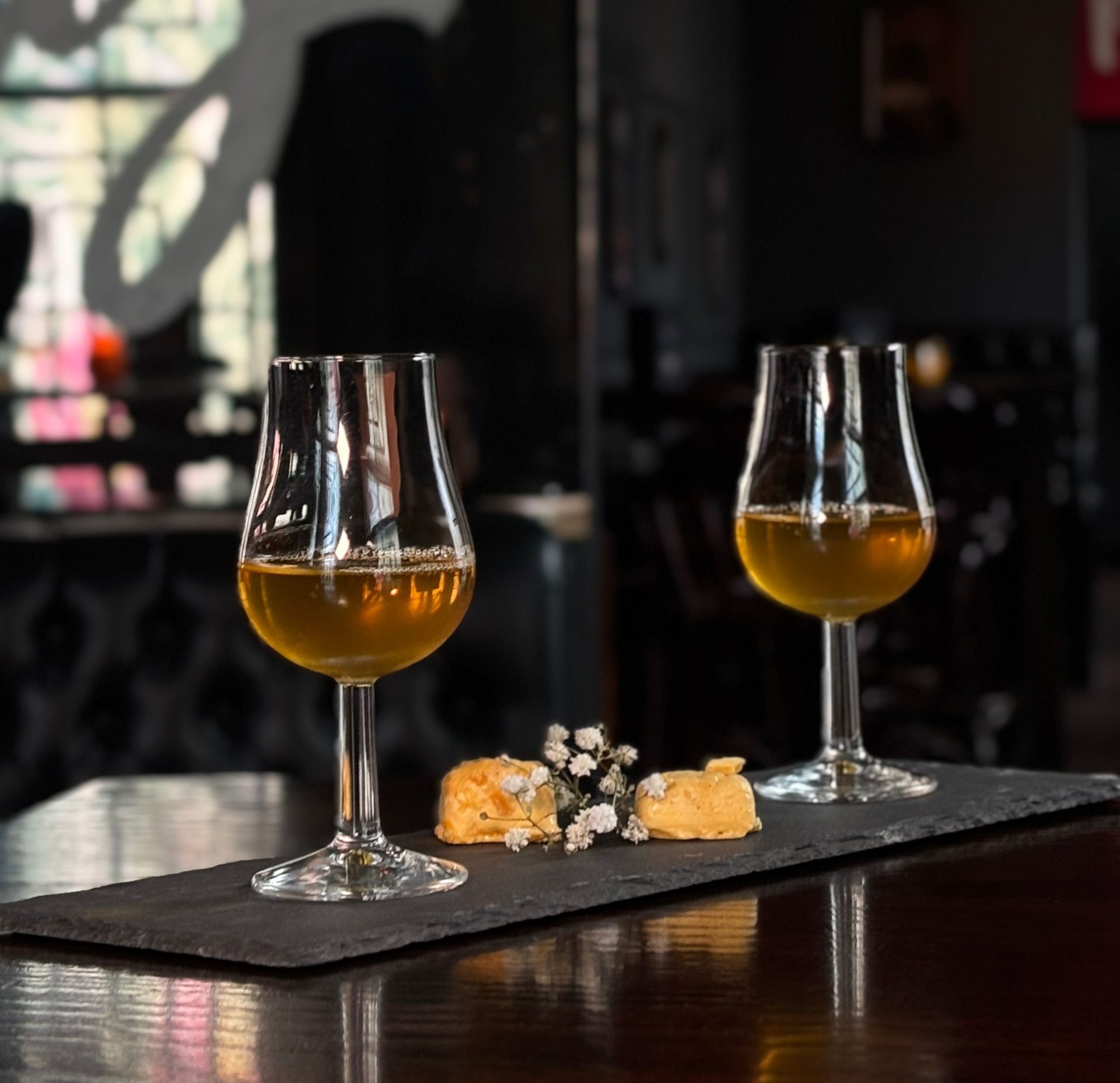 Image showing two cocktails from the famous drinkers cocktail experience served with a bite sized honeycomb